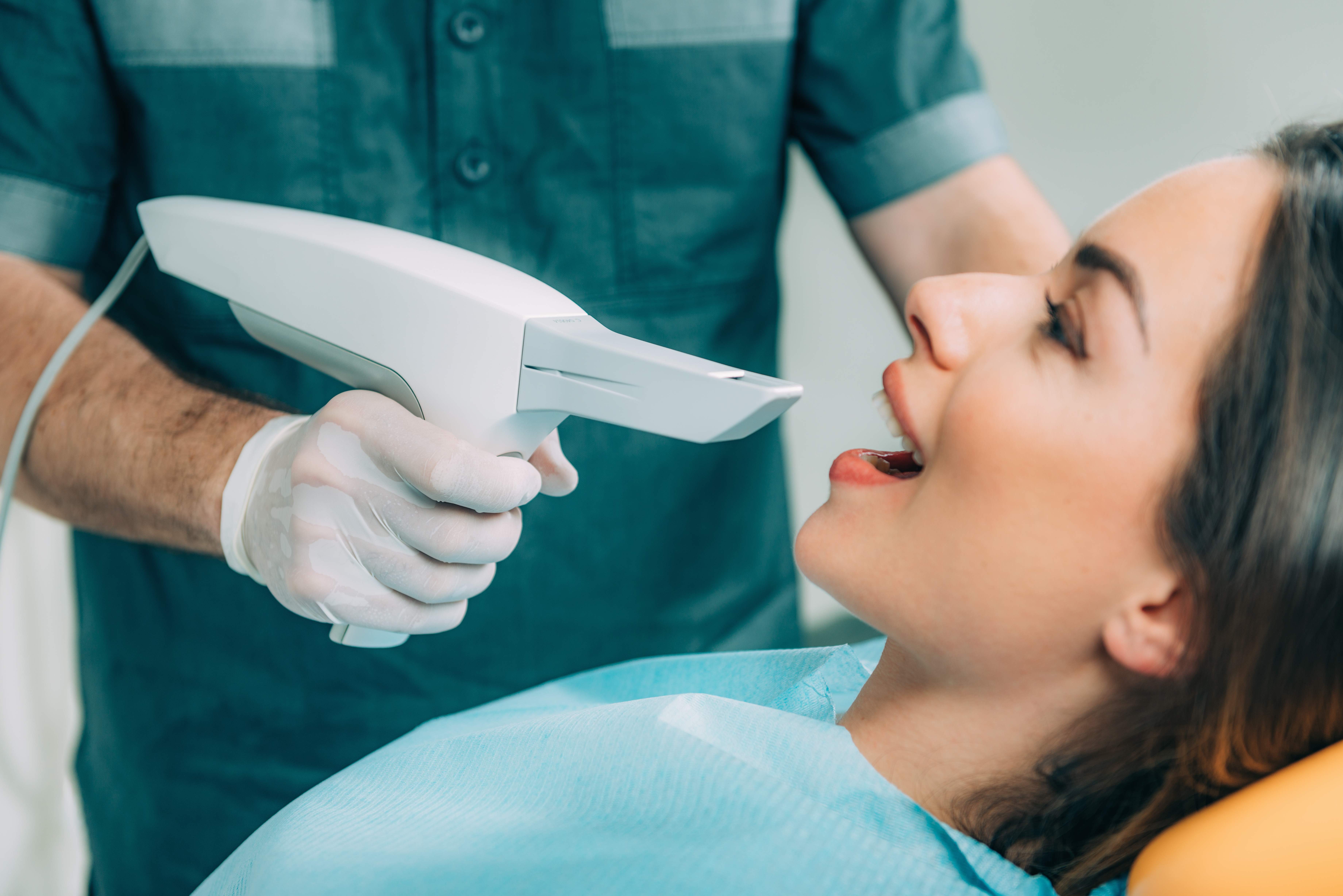 Woman sharing healthy smile after dental checkup and teeth cleaning